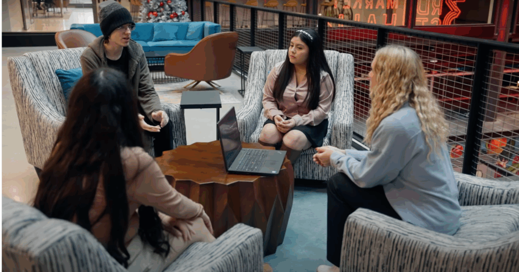 A group of four students collaborates to solve a real business problem.